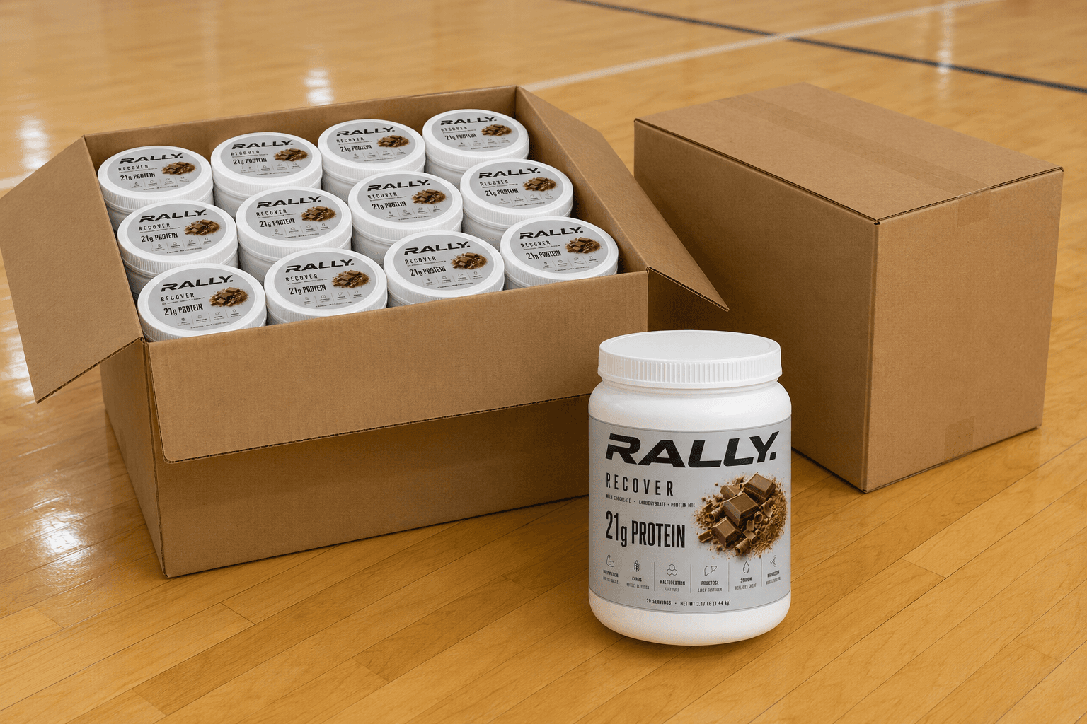 An open twelve-tub case of RALLY RECOVER on a gym floor