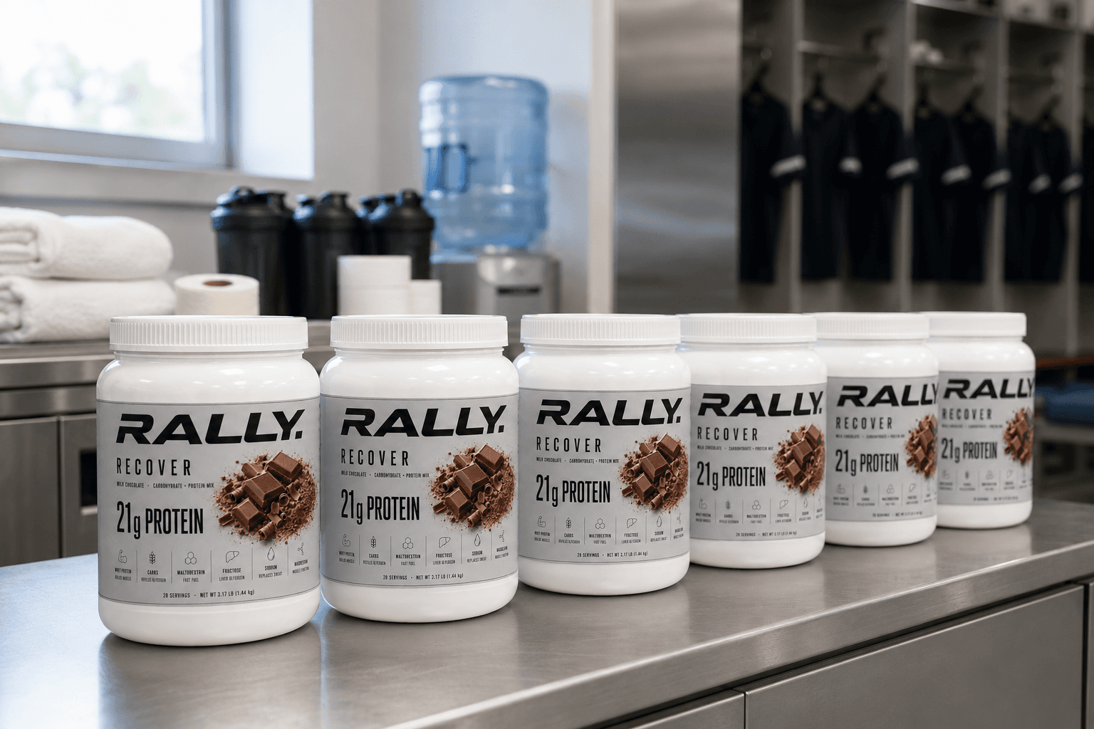Six tubs of RALLY RECOVER on a training-room counter
